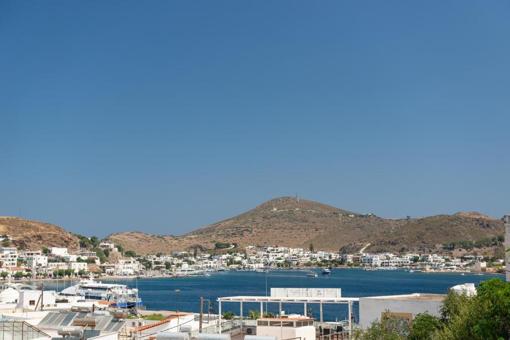 a view of a city and a harbor at El Greco Studios in Patmos