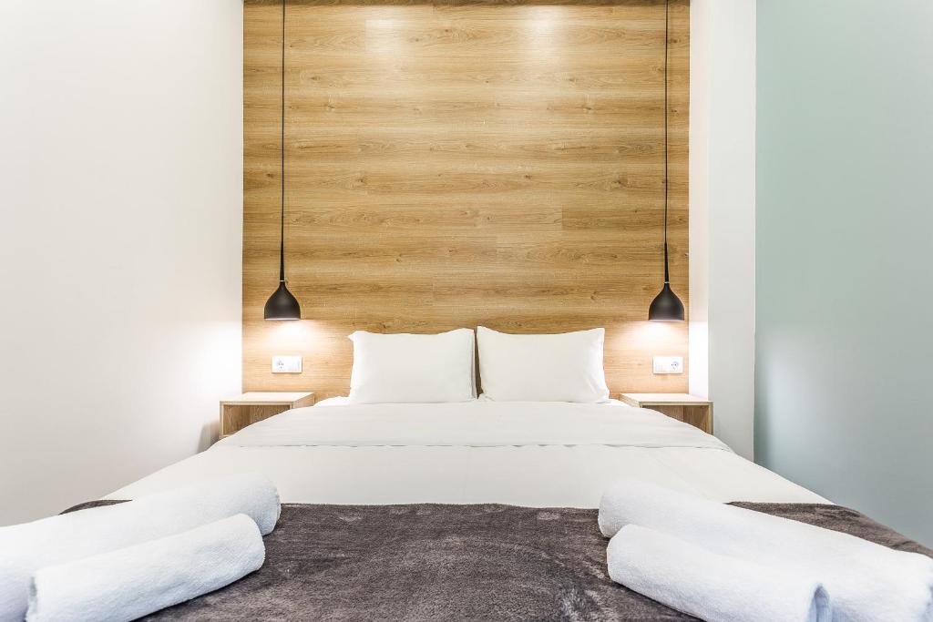 Postel nebo postele na pokoji v ubytování 8 Rooms Apartotel On Meidan