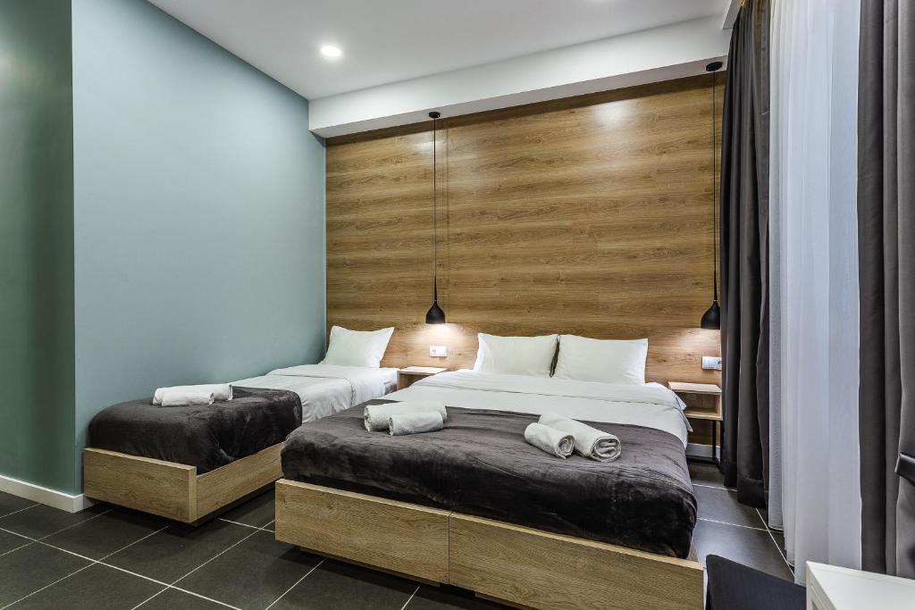 Postel nebo postele na pokoji v ubytování 8 Rooms Apartotel On Meidan