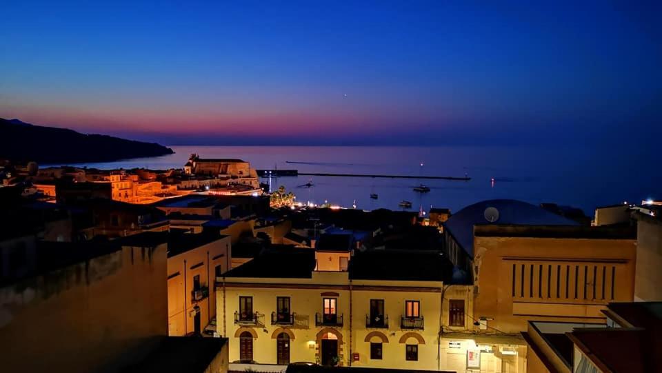 a view of a city at night at Aziyz Camere in Castellammare del Golfo