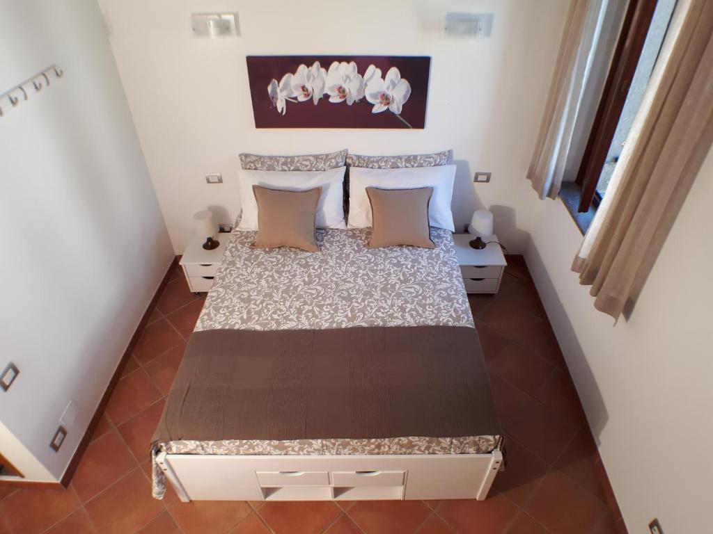Posteľ alebo postele v izbe v ubytovaní Alloggio turistico La Casa del Vignola