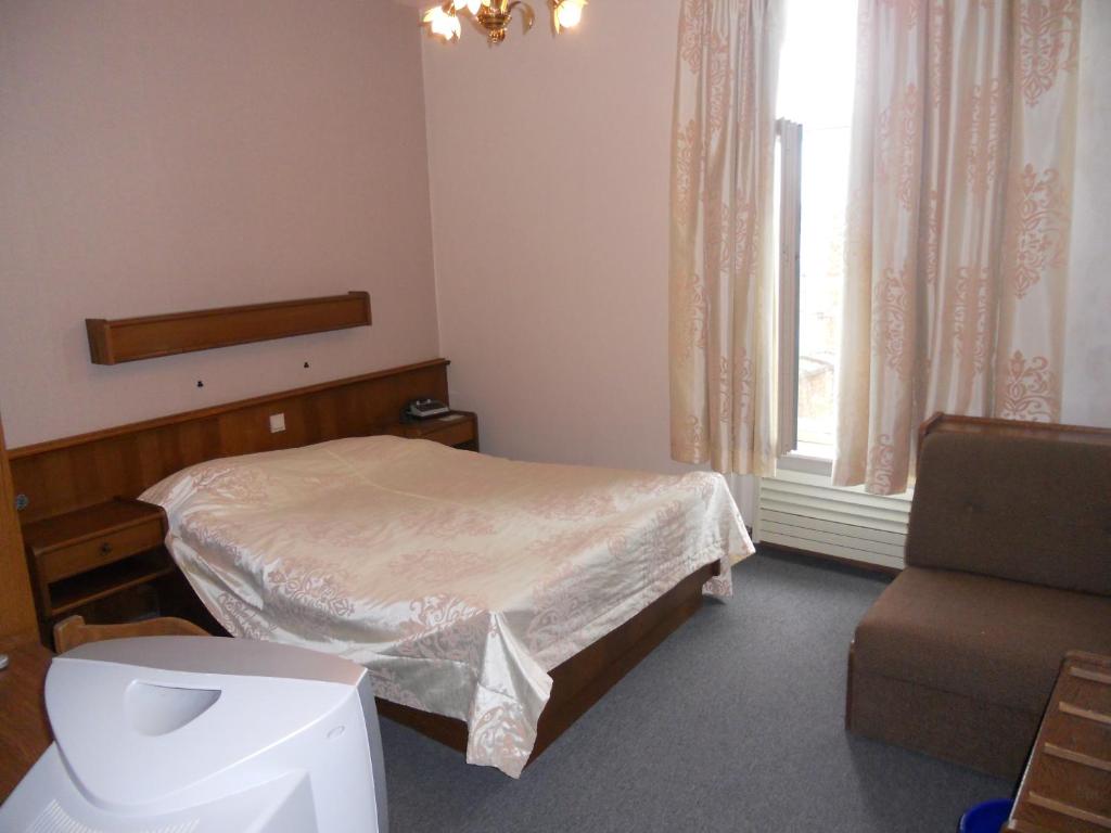 Postel nebo postele na pokoji v ubytování Hotel Ten Putte
