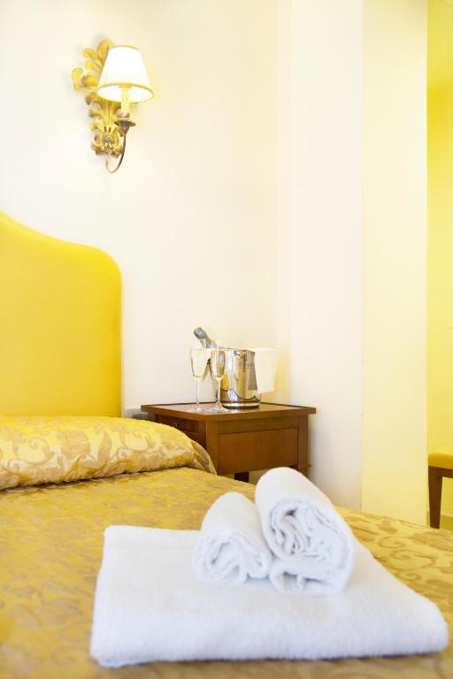 Postel nebo postele na pokoji v ubytování Hotel Lanzillotta