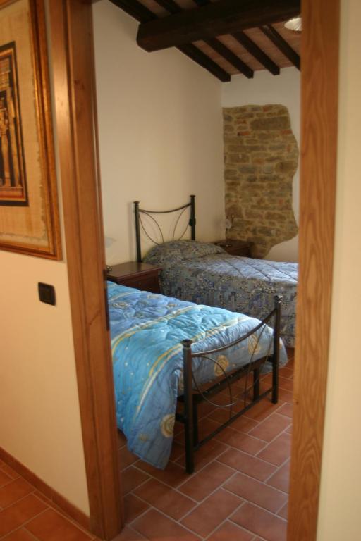 Postel nebo postele na pokoji v ubytování La Pietraia