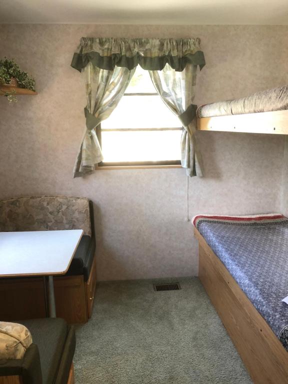 Voodi või voodid majutusasutuse Garden Bay Hideaway - Glamping & RV toas