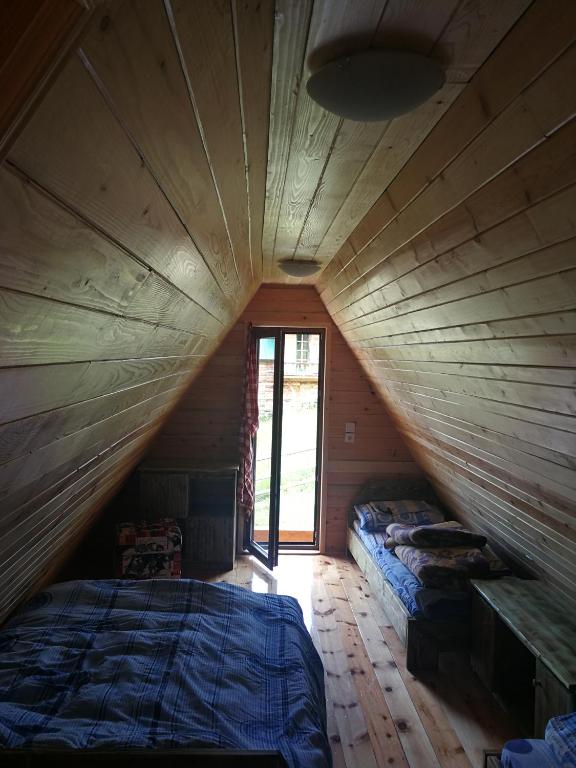 Postel nebo postele na pokoji v ubytování Guesthouse Planinarski dom Neviđen'o