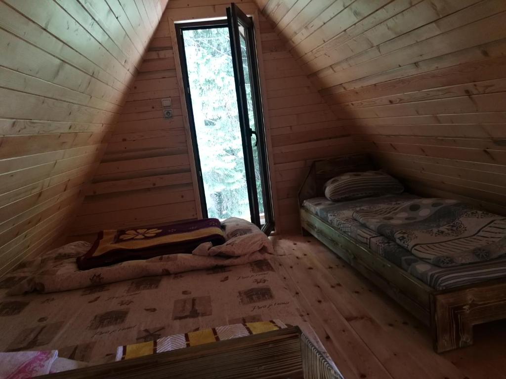 Postel nebo postele na pokoji v ubytování Guesthouse Planinarski dom Neviđen'o