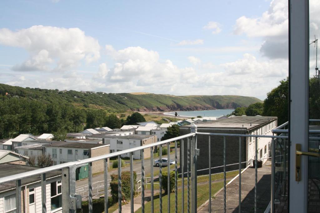 a view from the balcony of a building at Freshwater Bay Holiday Cottages in Pembroke