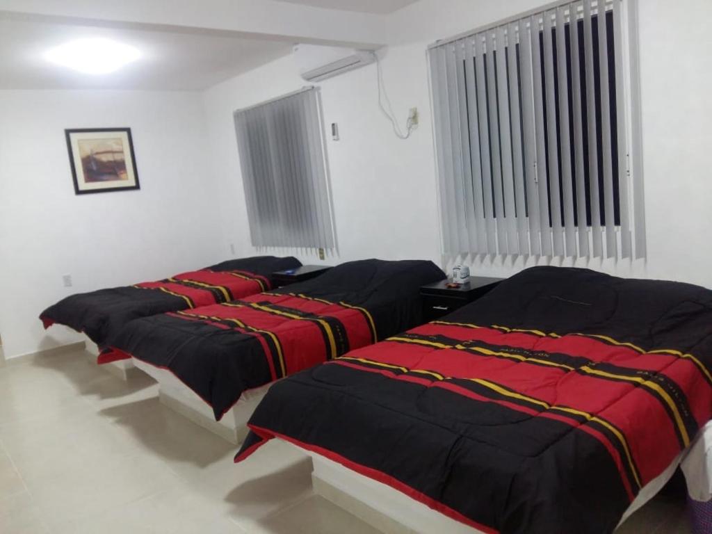 Postel nebo postele na pokoji v ubytování Hotel Playa Krystal
