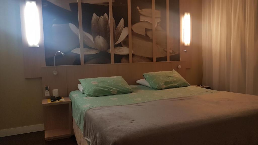 Postel nebo postele na pokoji v ubytování Flat Manaus