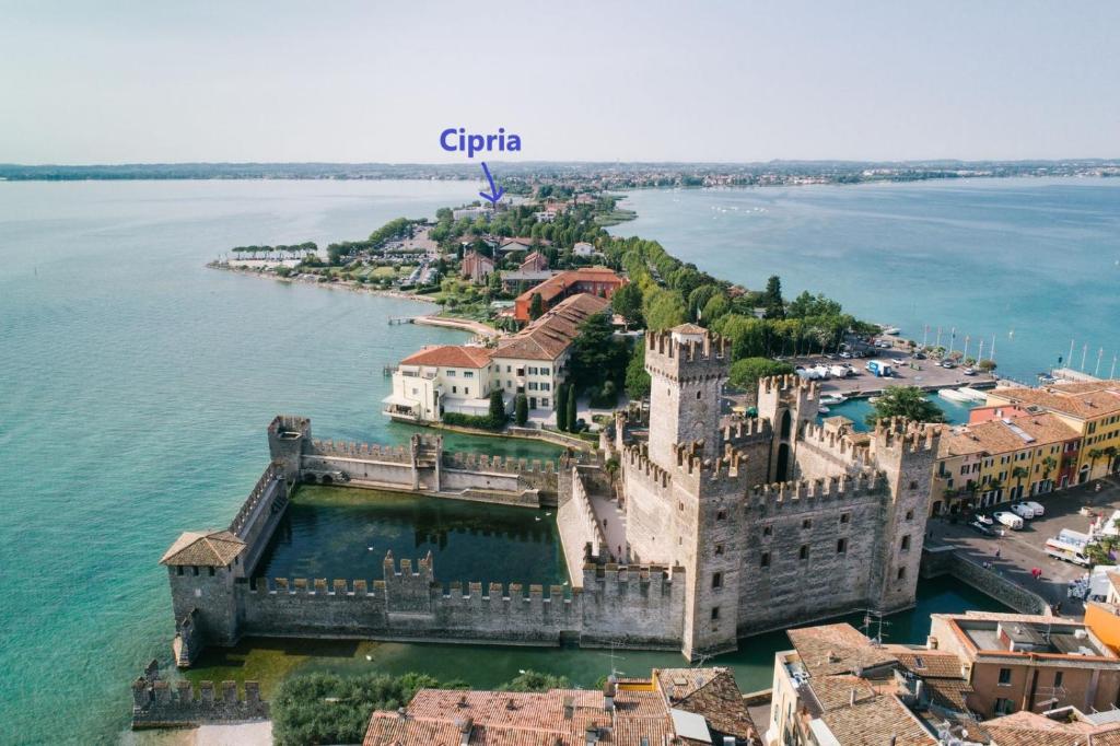 an aerial view of a castle in the water at Appartamento Cipria in Sirmione