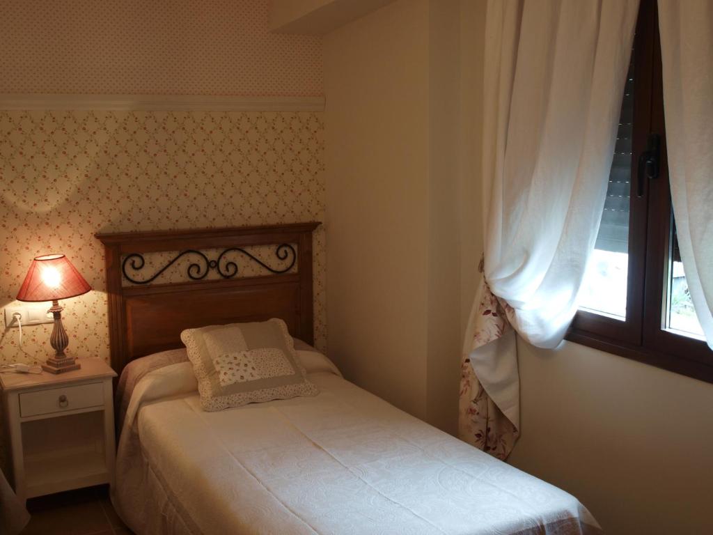 Postel nebo postele na pokoji v ubytování Casa Gallán
