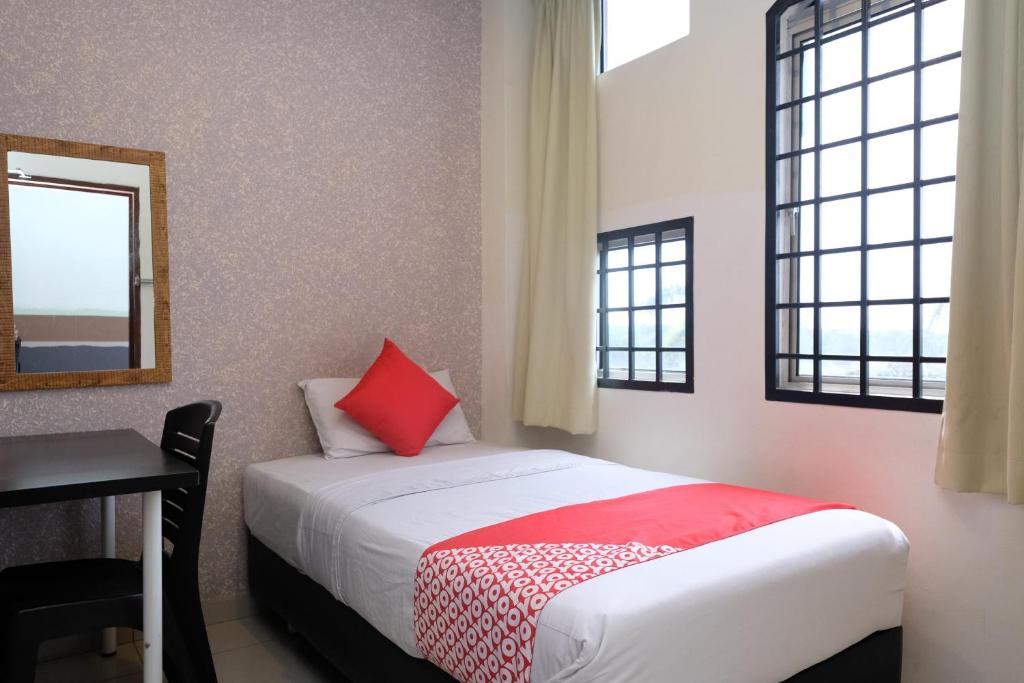 Postel nebo postele na pokoji v ubytování Hotel De' Tees, Masai Utama