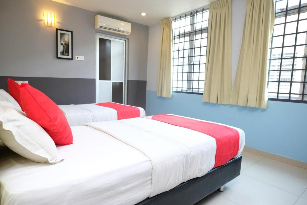Postel nebo postele na pokoji v ubytování Hotel De' Tees, Masai Utama