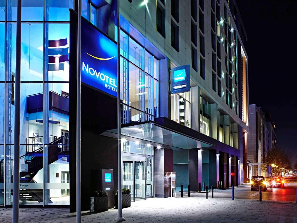 a building with a nundai sign on the side of it at Novotel London Excel in London