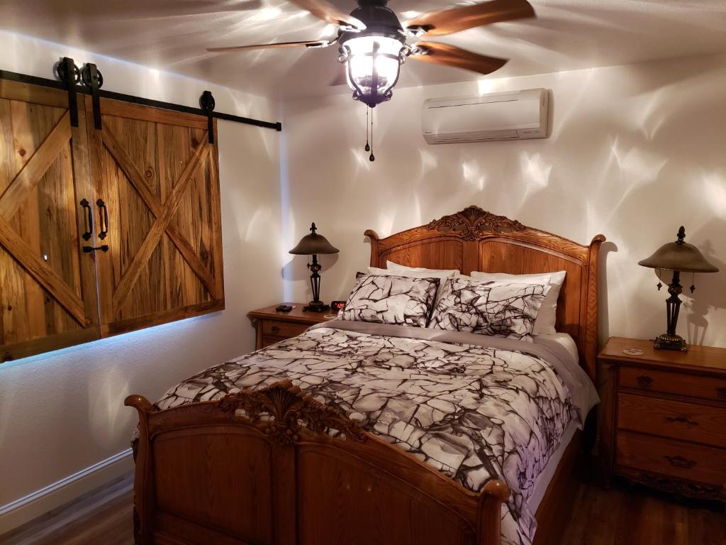 a bedroom with a bed and a ceiling fan at Yosemite Foothill Retreat - Private Guest Suite #2 in Coarsegold