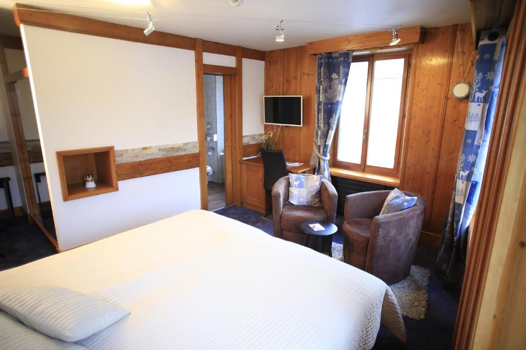 Postel nebo postele na pokoji v ubytování HOTEL de la Truite & SPA Le petit Nautilus