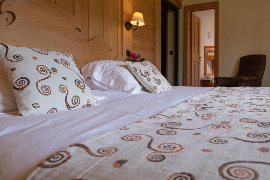 Postel nebo postele na pokoji v ubytování Le Chamois d'Or