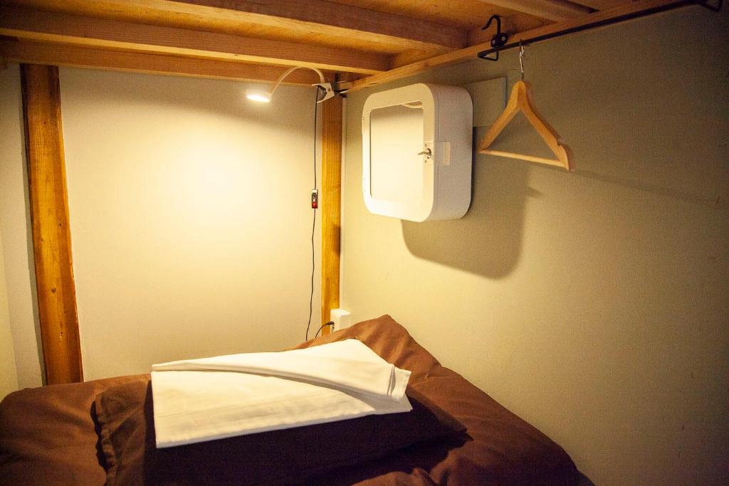 Postel nebo postele na pokoji v ubytování Fukuoka Guesthouse HIVE