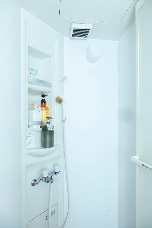 Kuchyň nebo kuchyňský kout v ubytování Fukuoka Guesthouse HIVE