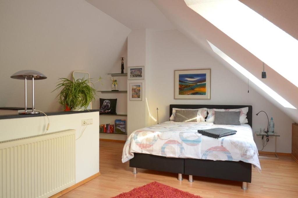 a bedroom with a bed in a attic at Ferienhaus Luzia in Darscheid