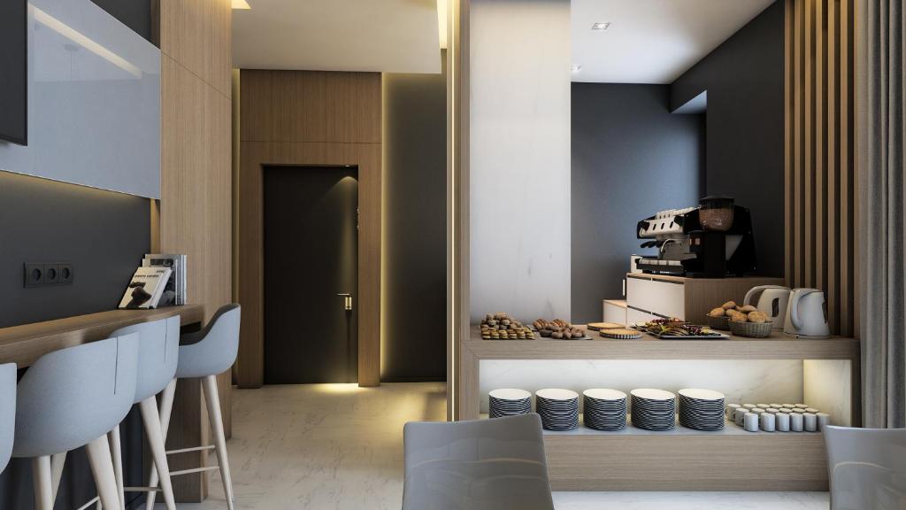 TV a/nebo společenská místnost v ubytování Concept Terrace Hotel