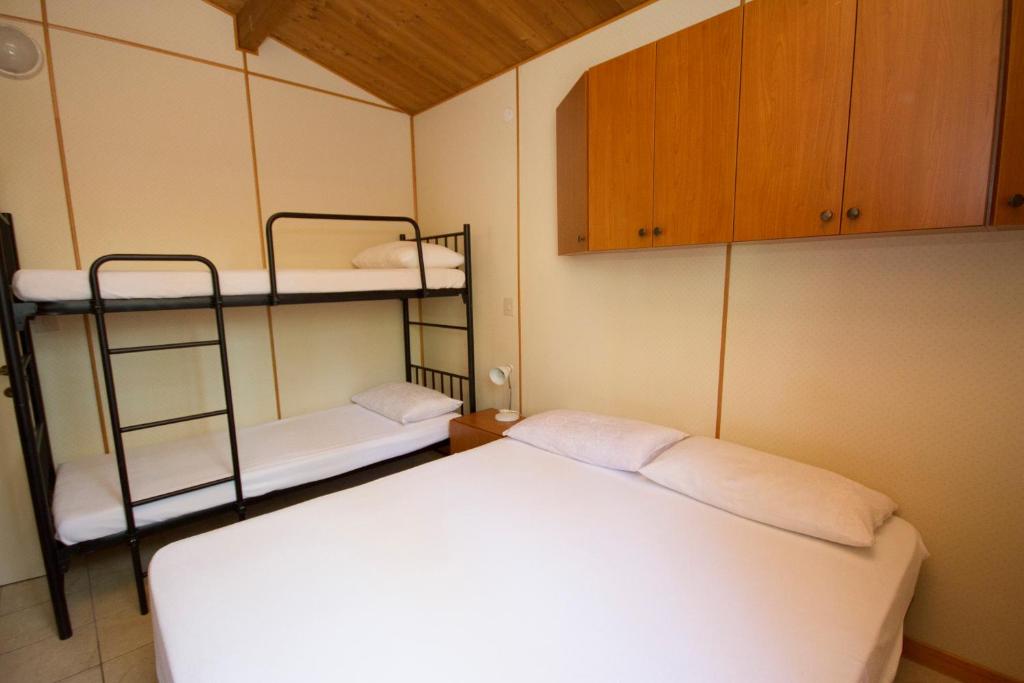 Postel nebo postele na pokoji v ubytování Camping Santin