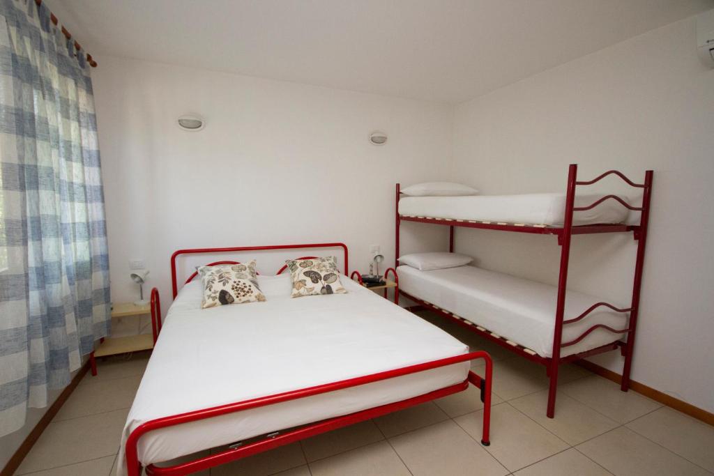 Postel nebo postele na pokoji v ubytování Camping Santin