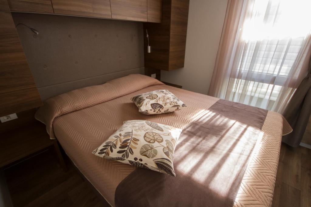 Postel nebo postele na pokoji v ubytování Camping Santin