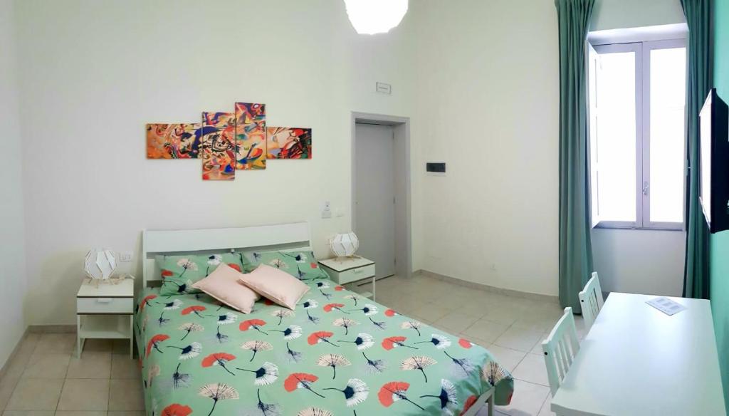 Łóżko lub łóżka w pokoju w obiekcie L'Opera dei Pupi B&b
