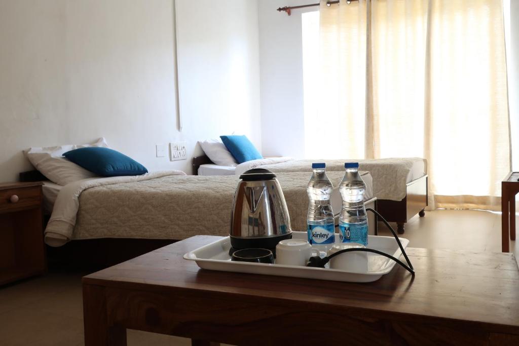 Postel nebo postele na pokoji v ubytování Zhim Zhim Guest House