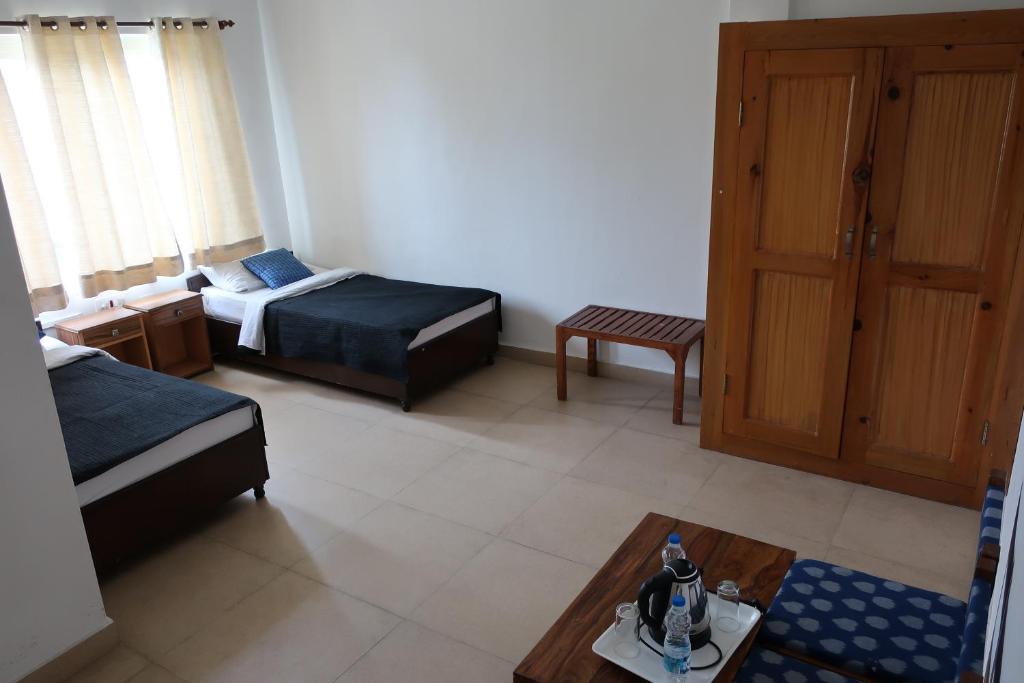 Postel nebo postele na pokoji v ubytování Zhim Zhim Guest House
