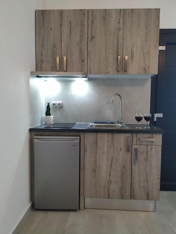 Kuchyň nebo kuchyňský kout v ubytování Home Sweet Home