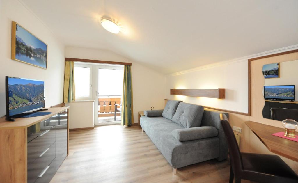 TV a/nebo společenská místnost v ubytování Hotel-Garni Seestrand