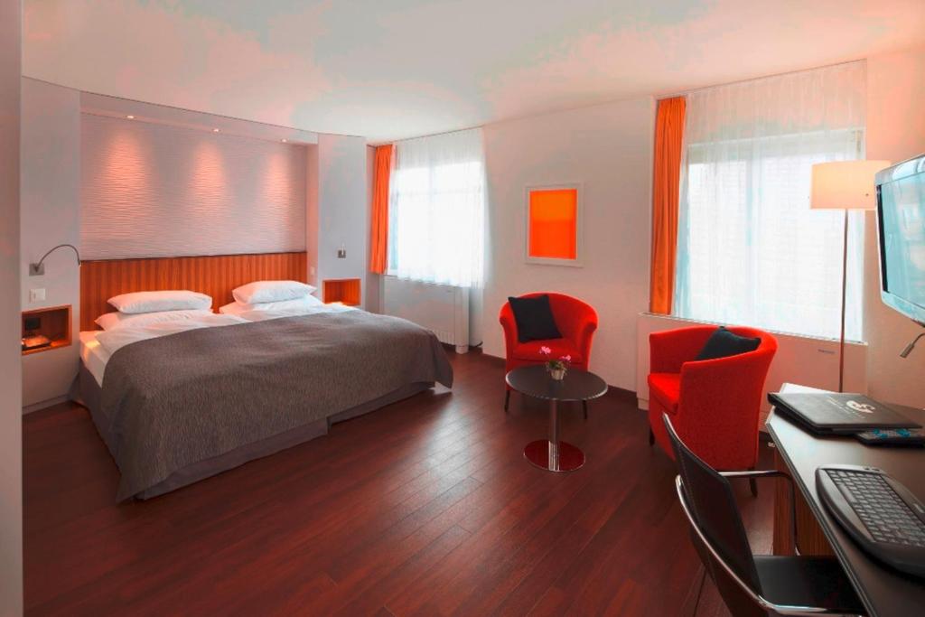 Postel nebo postele na pokoji v ubytování Sorell Hotel Rütli
