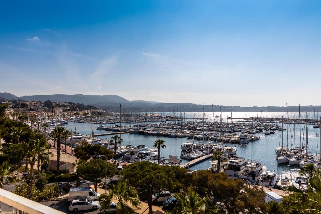 a marina filled with lots of boats in the water at Résidence Le Beau Rivage in Bandol