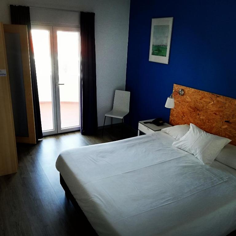 Postel nebo postele na pokoji v ubytování Hotel Eira Da Pedra