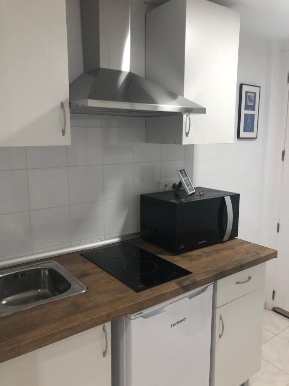 Kuchyň nebo kuchyňský kout v ubytování Apartamento City & Beach