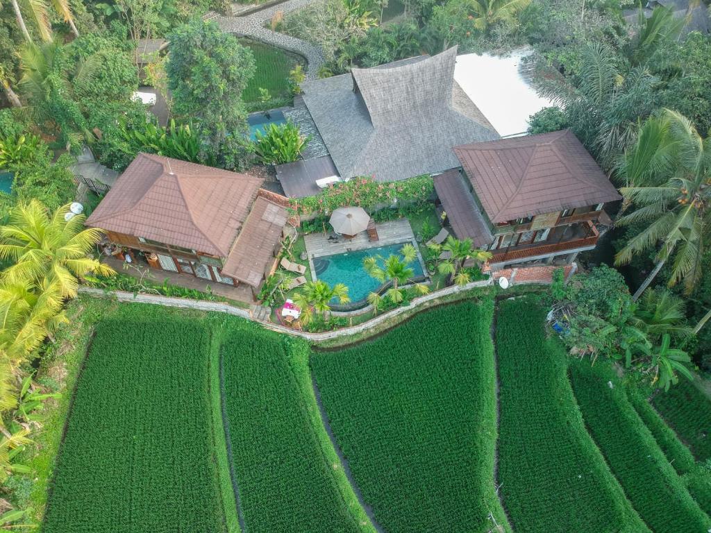 an aerial view of a house with a garden at Gusde Tranquil Villas by EPS in Ubud