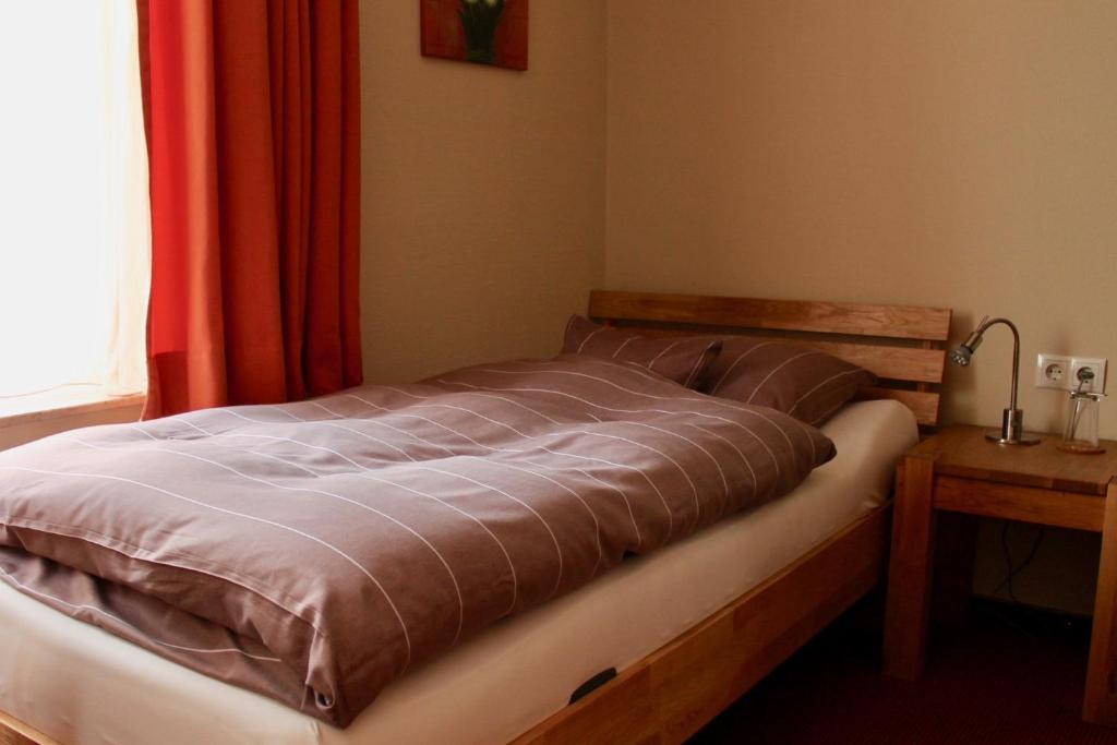 Postel nebo postele na pokoji v ubytování Hotel Donnersberg