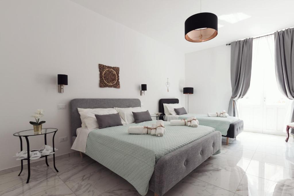 Postel nebo postele na pokoji v ubytování Calafatari B&B
