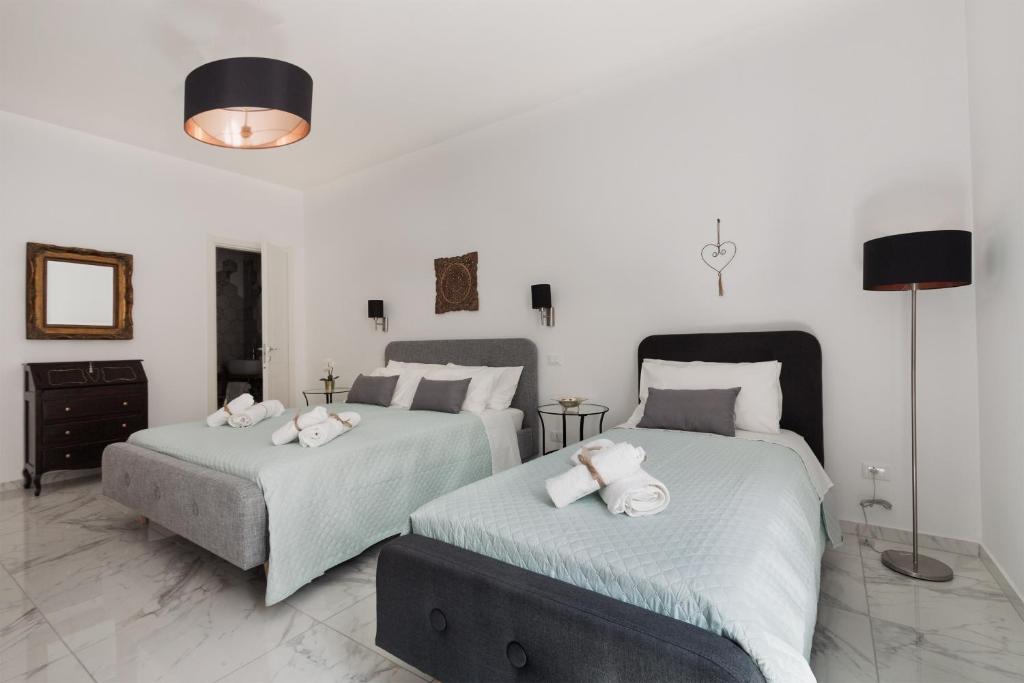 Postel nebo postele na pokoji v ubytování Calafatari B&B