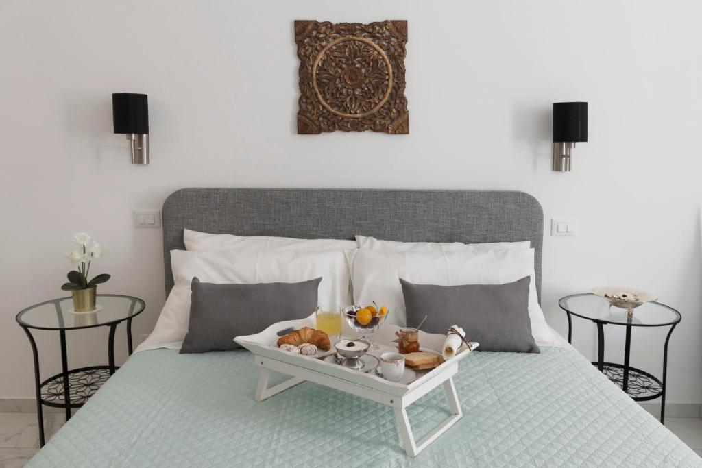 Postel nebo postele na pokoji v ubytování Calafatari B&B