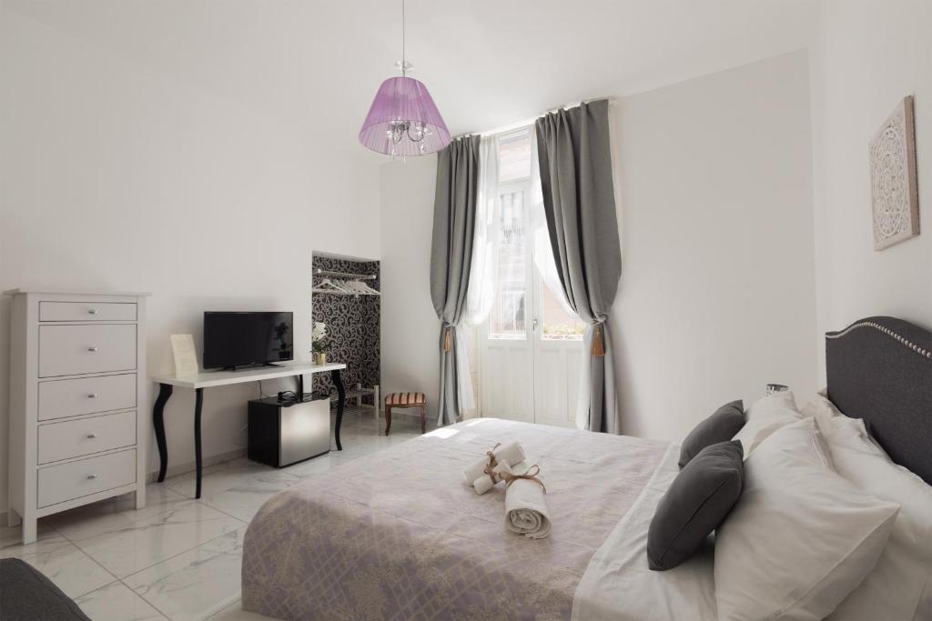 Postel nebo postele na pokoji v ubytování Calafatari B&B