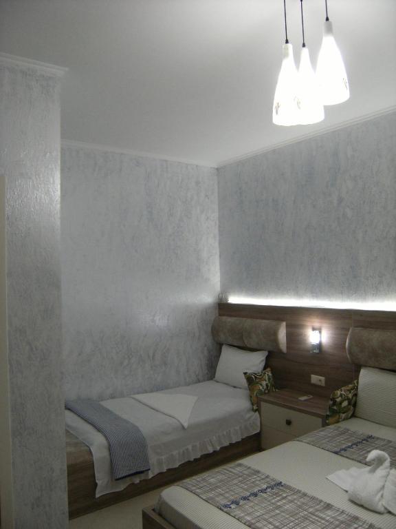 Postel nebo postele na pokoji v ubytování Hotel Ergo