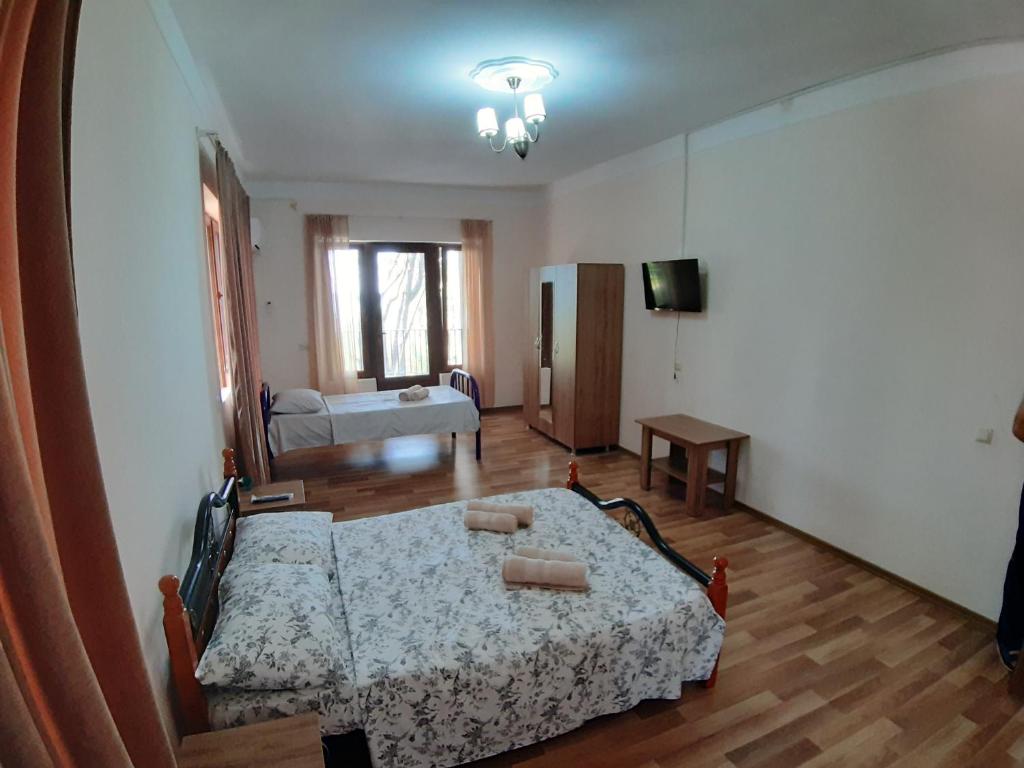 Postel nebo postele na pokoji v ubytování Hotel Niko