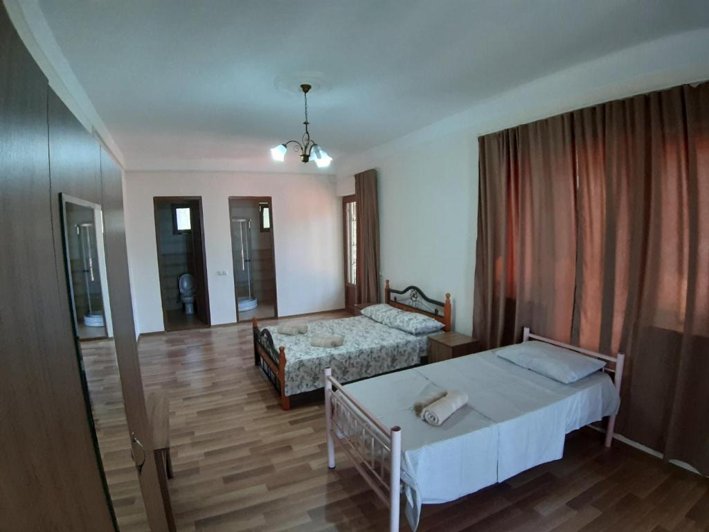 Postel nebo postele na pokoji v ubytování Hotel Niko