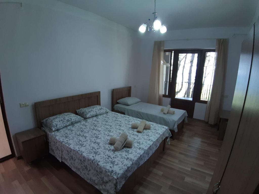 Postel nebo postele na pokoji v ubytování Hotel Niko