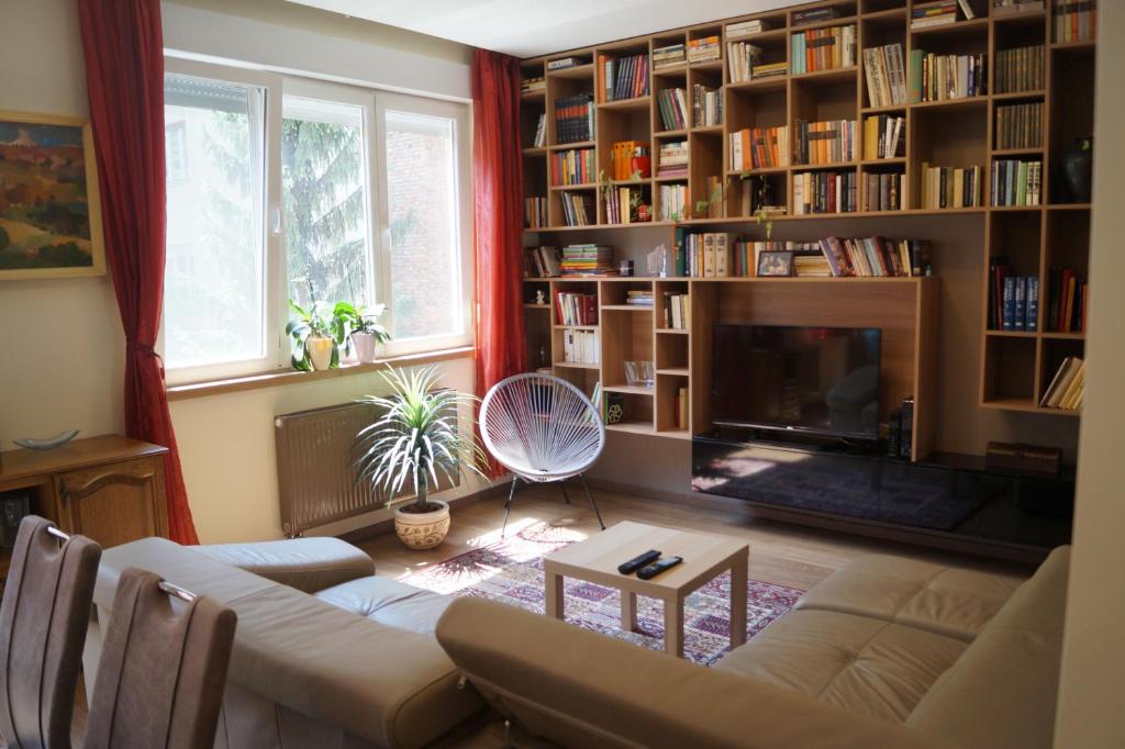 a living room with a couch and a fireplace at Mamini's Apartment in Budapest