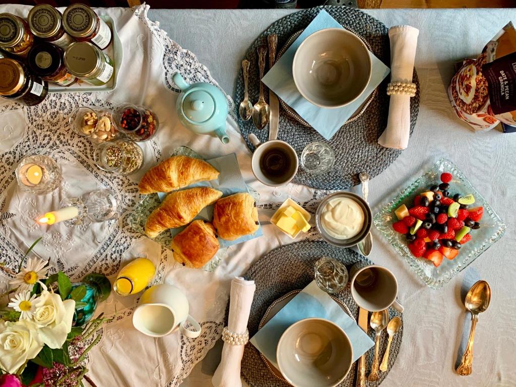 a table with breakfast foods and cups of coffee at The Tea House in Rye